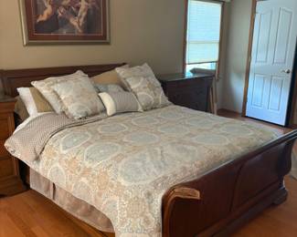 Queen sleigh bed , with mattress and box spring , Bedspread has matching drapes , nice neutrals 