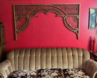 Lovely Antique Couch with ornate Mahogany Trim. Actually, it is very comfortable. Antique ornate wall decor - we have several panels