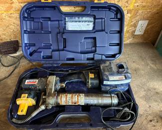 Lincoln 12V rechargeable grease gun with (2) battery chargers, and case.