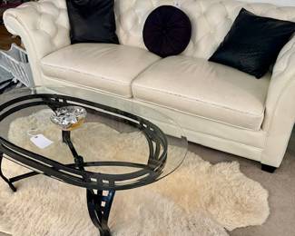 Tucked White leather Sofa & Loveseat Set
Glass Coffee Table
Sm Sheepskin style Rugs