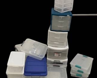 A Towering Tower of Plastic Containers w Lids
