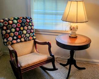 Round Traditional pedestal table with leather inlay and gold tooling * 20th-century revival upholstered rocking chairs