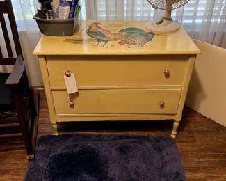 small chest, rugs, fan