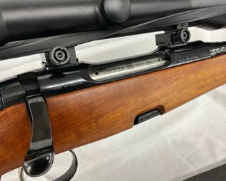 Bolt action system marked ‘System SBS 96.’ Barrel with a fluted design and integrated iron sights.