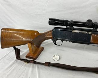 Rifle with Redfield Scope
