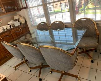 #107 Beveled Glass Top Table w/Brass Base w/6 Rolling Chairs - 42x72Lx28T $75.00