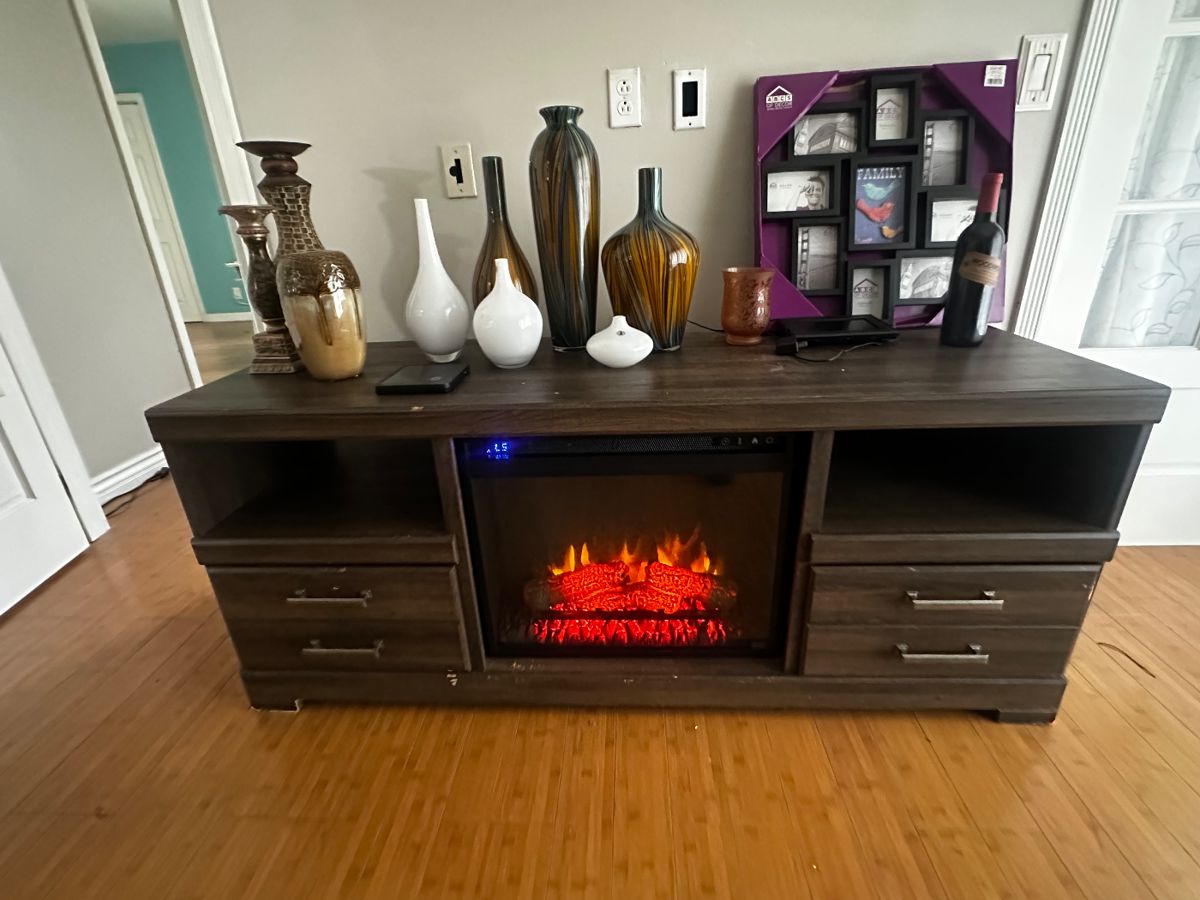 Working electronic fireplace/heater TV console $25