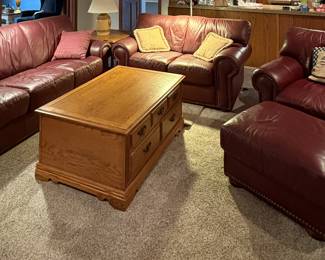 Leather living room set with coffee table, end table and lamp (each piece sold separately).