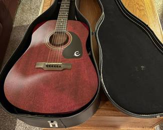 Gibson Epiphone acoustic guitar with strap and case. In great condition; nice mellow sound.
