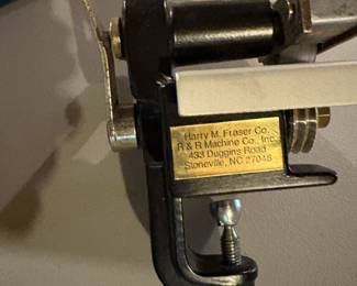 Fraser cutting machine for cutting uniform strips of fabric.