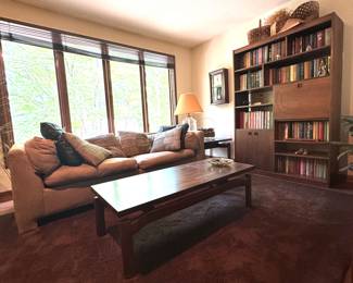 Sofa, Bookcase Wall Unit, Coffee Table and Several Books 
