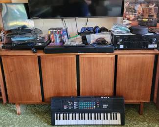 Turntables, Nintendo, playstation, sound bar, DVD player on vintage sideboard