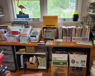 Sewing kits, craft magazines, boxes of material and maps
