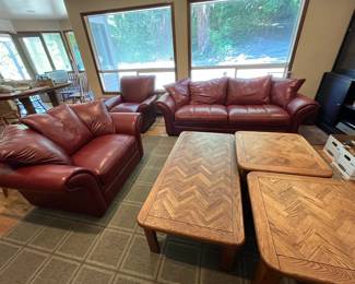 leather couch, loveseat, chair, ottoman; parquet-top coffee and end tables