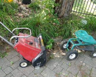 Snow blower and garden scoot around chair