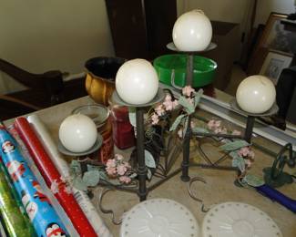 Round candles, and metal and glass candle holder