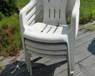 Stack of four plastic chairs, needs a little Simple Green cleaning, but in perfect condition