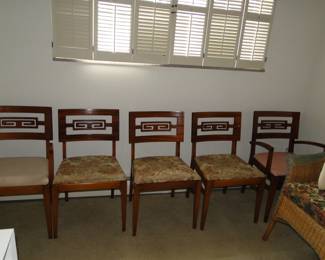 Five remarkably lined up chairs
