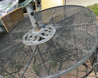 Because the umbrella base should always go on the top of the table