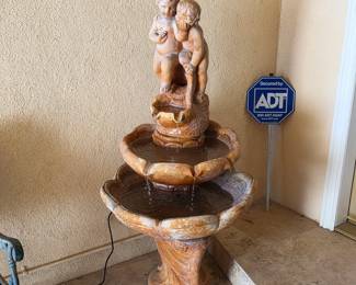Stone two-tier cherub water fountain