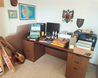 Another office desk with printers and office misc