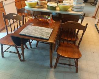 Dropleaf dining or kitchen table with 6 chairs.   I assure you, 6 chairs.  We just don't have them all in the picture