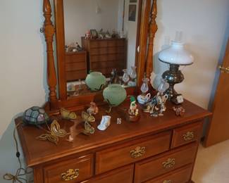 Dresser with curved top mirror