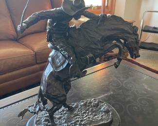 Large Remington bronze statue called bucking bronco