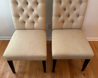 C55 - $40. Pair of Upholstered Dining Chairs. Measures 20" wide x 26" deep x 41" tall.
