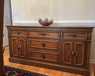 C32 - $100. Thomasville Buffet. Measures 66" wide x 20" deep x 32" tall. Sturdy and overall in good condition. Drawers slide, doors open. Has a water ring on the top right.