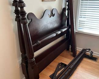 C150 - $50. Wooden Bed Frame. Measures 59" wide x 53.5" tall. Includes metal