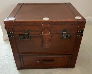 C12 - $10. Decorative Faux Leather Chest. Measures 23.5" x 14.5" x 18" tall. Trim around all edges need reglued - see photo.