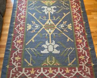C155 - $95. Area Rug Measures 61" x 82".