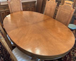 C33 - $150. Thomasville Dining Table & Chairs. 2 Captains & 6 Regular. Chairs need reupholstered. Table has minor damage to the finish on the top. Sturdy! Table is 68" long (no leaves in) x 44" wide x 29.5" tall. Set includes 2 leaves are each 18" wide.