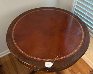 C67 - $60. Round Mahogany & Leather Top Table. Measures 28" across x 28" tall.