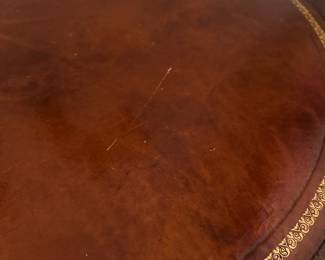 C67 - $60. Round Mahogany & Leather Top Table. Measures 28" across x 28" tall.