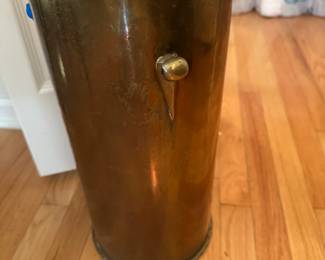 C62 - $30. Brass Umbrella Stand (could also be trash can). Measures 8.5" wide x 18" tall. Missing one handle ring.