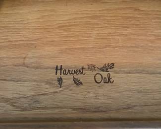 C100 - $40. Harvest Oak Corner Table. Measures 49" across at the widest point. Each corner comes out from the wall 35" x 25" tall.