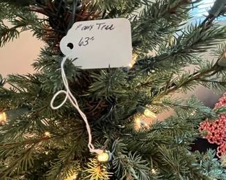 C103 - $30. Faux Christmas Tree measures 63" tall.