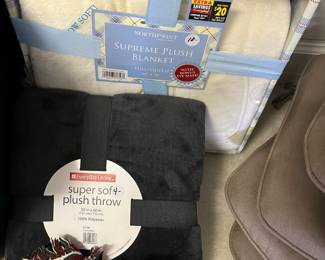 C140 - $10 New in Package White Blanket. $4 Green Throw.