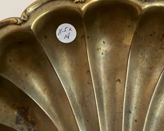 C111 - $15. Brass Candle Sconce. Measures 11.5" wide x 14" tall.