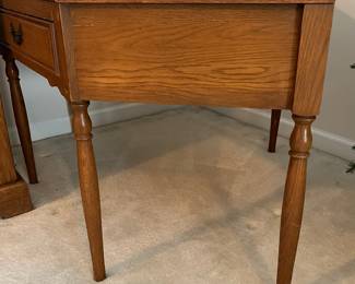 C100 - $40. Harvest Oak Corner Table. Measures 49" across at the widest point. Each corner comes out from the wall 35" x 25" tall.