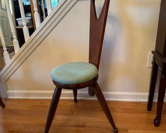 C40 - $30. Three Legged Stool. 14" wide x 33" tall. Wooden frame with upholstered seat.