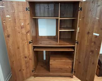 C145 - $30. Desk / Armoire. Purchased from Lowes. Pressed wood. Measures 34.75" wide x 19.5" deep x 63.5" tall.