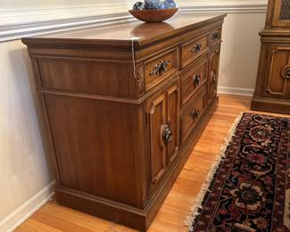 C32 - $100. Thomasville Buffet. Measures 66" wide x 20" deep x 32" tall. Sturdy and overall in good condition. Drawers slide, doors open. Has a water ring on the top right.