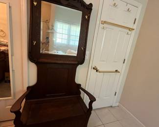 C2 - $275. Antique Oak Hall Tree. Bottom opens for storage. Hooks and mirror have been replaced at sometime. Otherwise - great antique condition. Measures 38" wide x 16" deep x 77" tall.