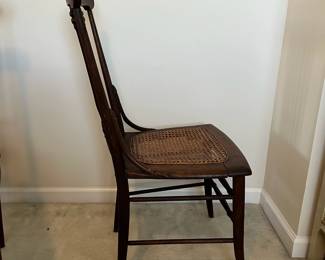 C102 - $50 PAIR of Antique Spindle Chairs. Single Caned - no holes but aged caning. Measures 16.5" wide x 17" floor to seat x 35.5" tall.