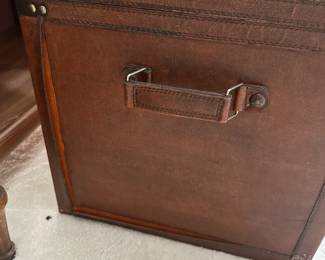 C12 - $10. Decorative Faux Leather Chest. Measures 23.5" x 14.5" x 18" tall. Trim around all edges need reglued - see photo.