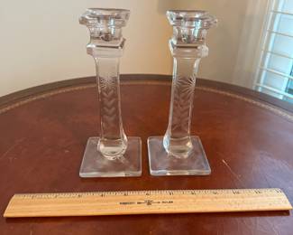 C75 - $6. Pair of glass candlesticks.