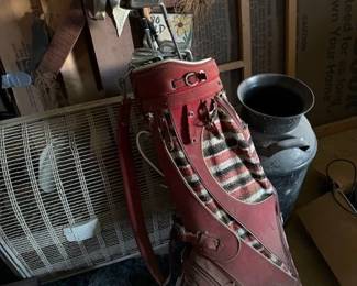 Milk can. Big fan. Vintage clubs with cool bag. 